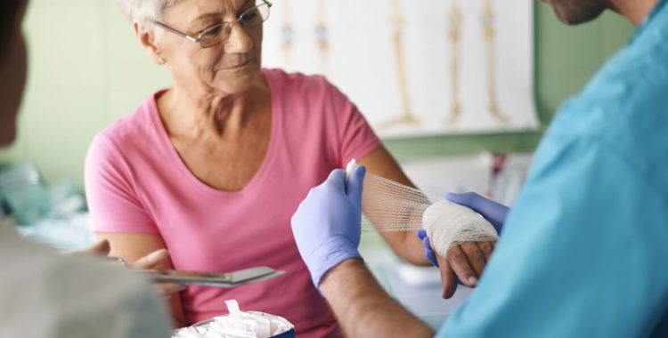Senior woman with bandage on the hand
