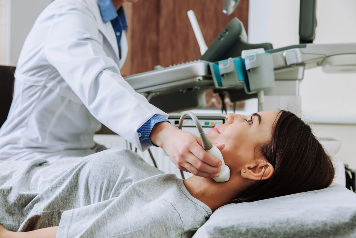 Woman undergoing ultrasound scan in clinic