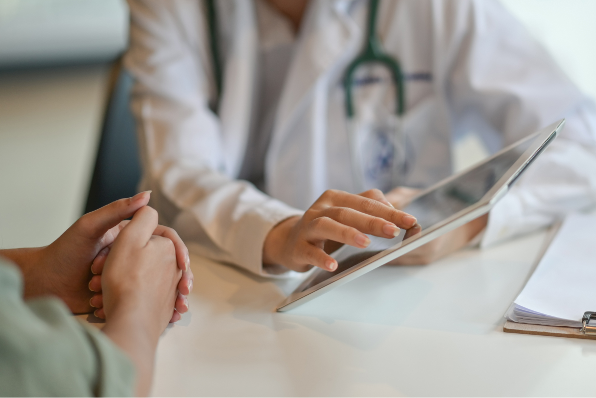 doctor showing a patient some information