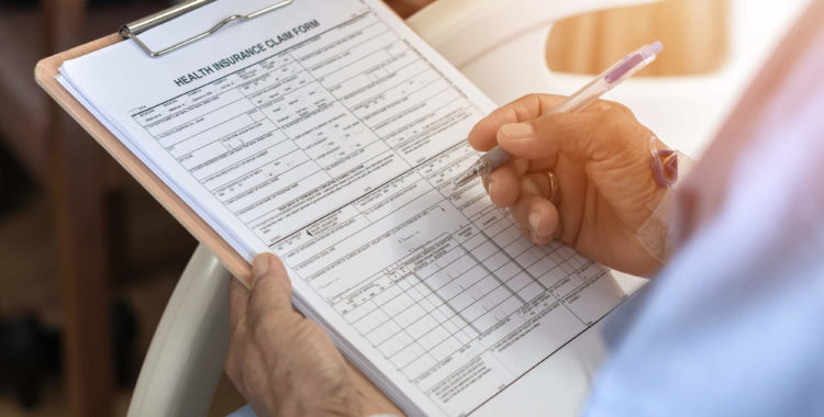 Health insurance claim form application for medicare coverage and medical treatment for patient with illness, accident injury and admitted in hospital ward