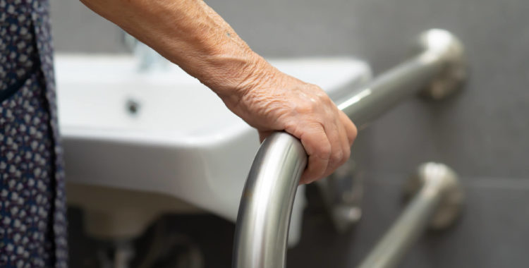 Asian senior or elderly old lady woman patient use toilet bathroom handle security in nursing hospital ward : healthy strong medical concept.