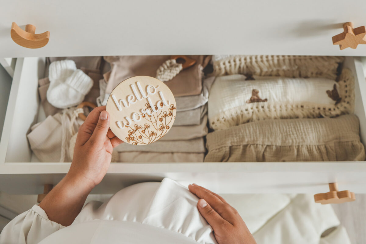 Wooden board handmade with the inscription: hello world, waiting for the baby