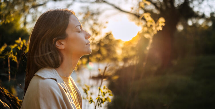 Woman enjoying sunset in nature