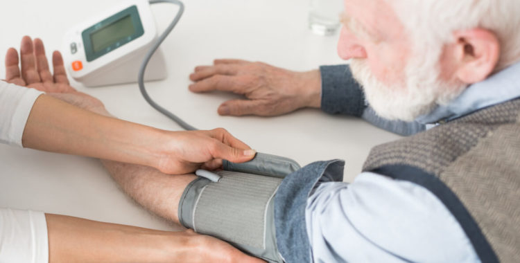 nurse measuring blood pressure