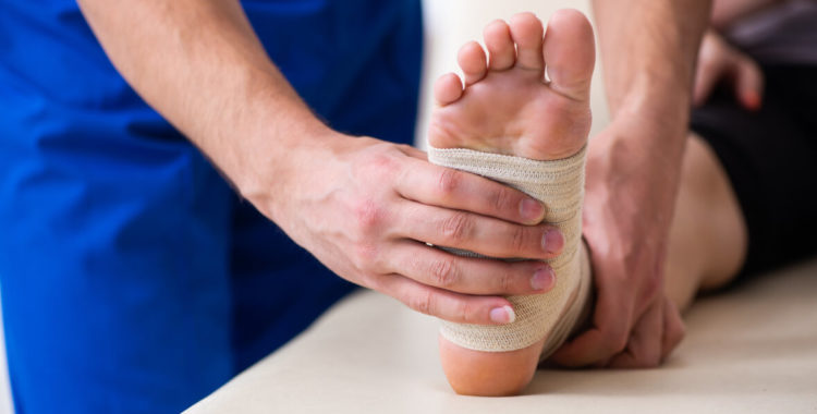 Leg injured woman visiting young doctor traumatologist