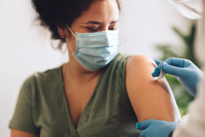 woman getting covid shot