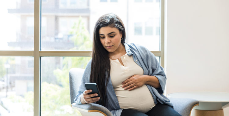 Pregnant woman, waiting to see therapist, text messages on phone