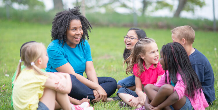 Camp Counselor and Children at Summer Camp