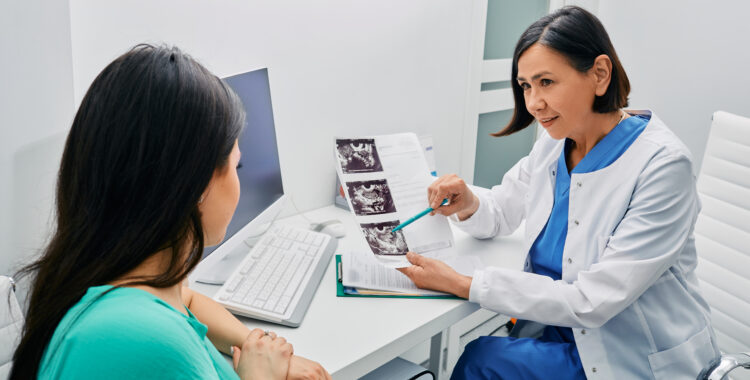Adult woman getting consultation on her exam results and ovaries ultrasound from her gynecologist. Gynecology and treatment of gynecological diseases
