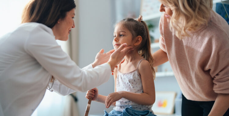 Young Girl and Caring Doctor in a Pediatric Office Setting