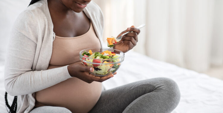 Black Pregnant Woman Holding Bowl With Fresh Vegetable Salad, Enjoying Healthy Nutrition
