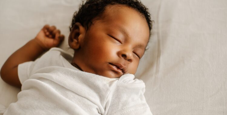 newborn sleep in the bed.