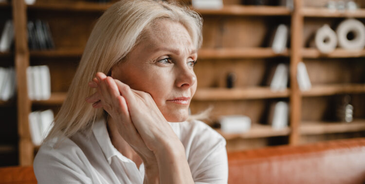 Psychologist appointment. Stressed sad tired exhausted caucasian middle-aged mature businesswoman freelancer relaxing on the couch sofa, thinking about family marriage work problems at work office