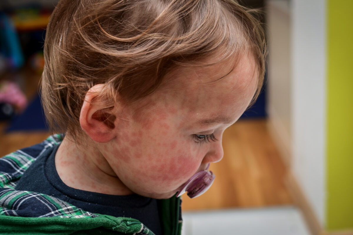Close-Up Portrait Of Boy Looking Away At Home