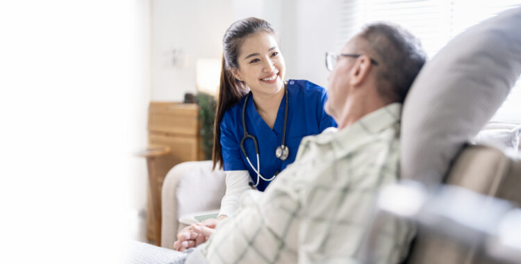 Young female doctor talking with her Elderly male patients to encourage in nursing home