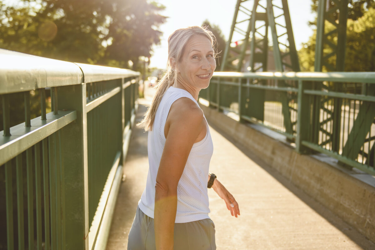 great sporty woman jogging outdoors on sunset time