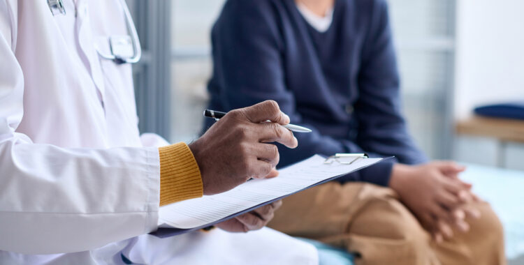 Doctor Holding Clipboard Consulting Child