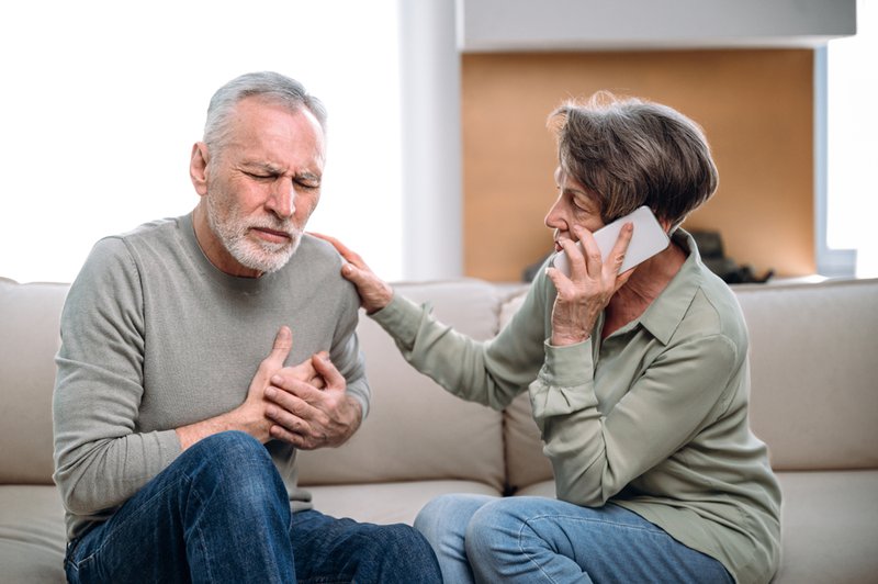 Woman calling 911, what to do if someone is having a stroke