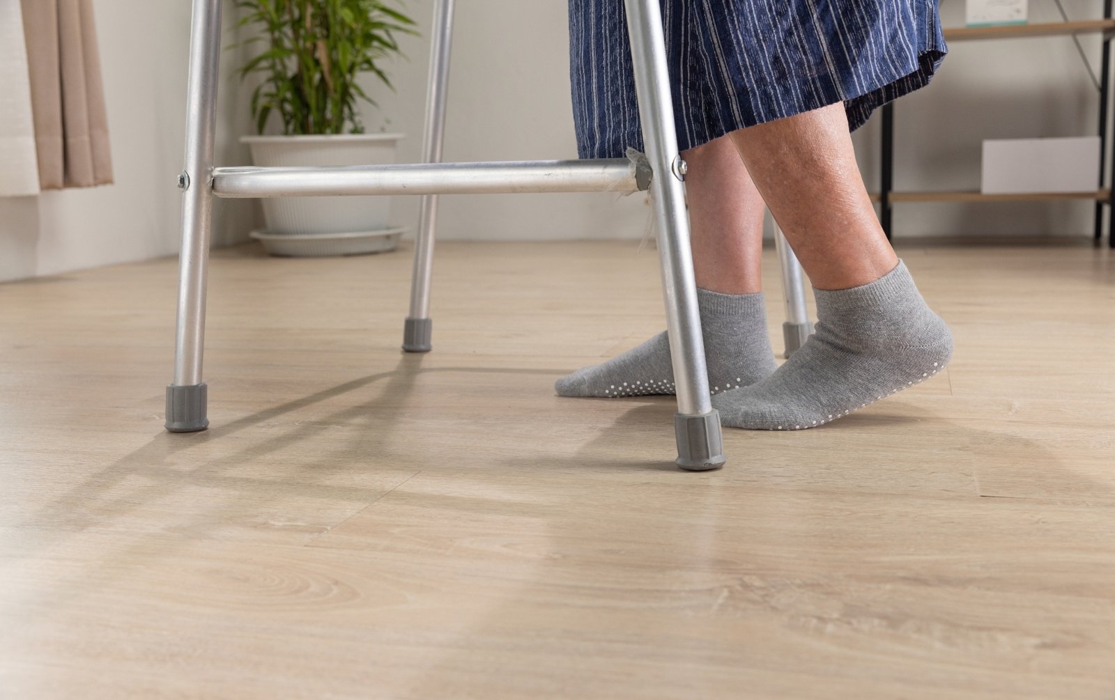 Elderly woman with a walker can benefit from home health care