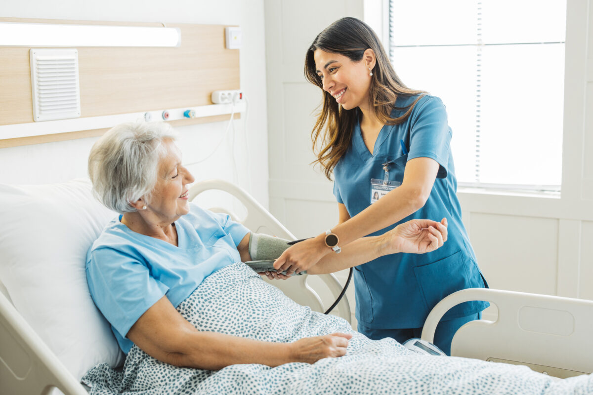 Senior woman in hospital bed