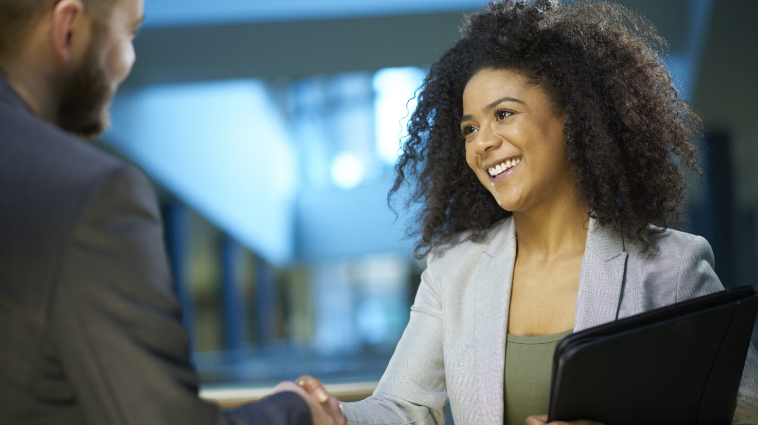 job applicant shaking hands .