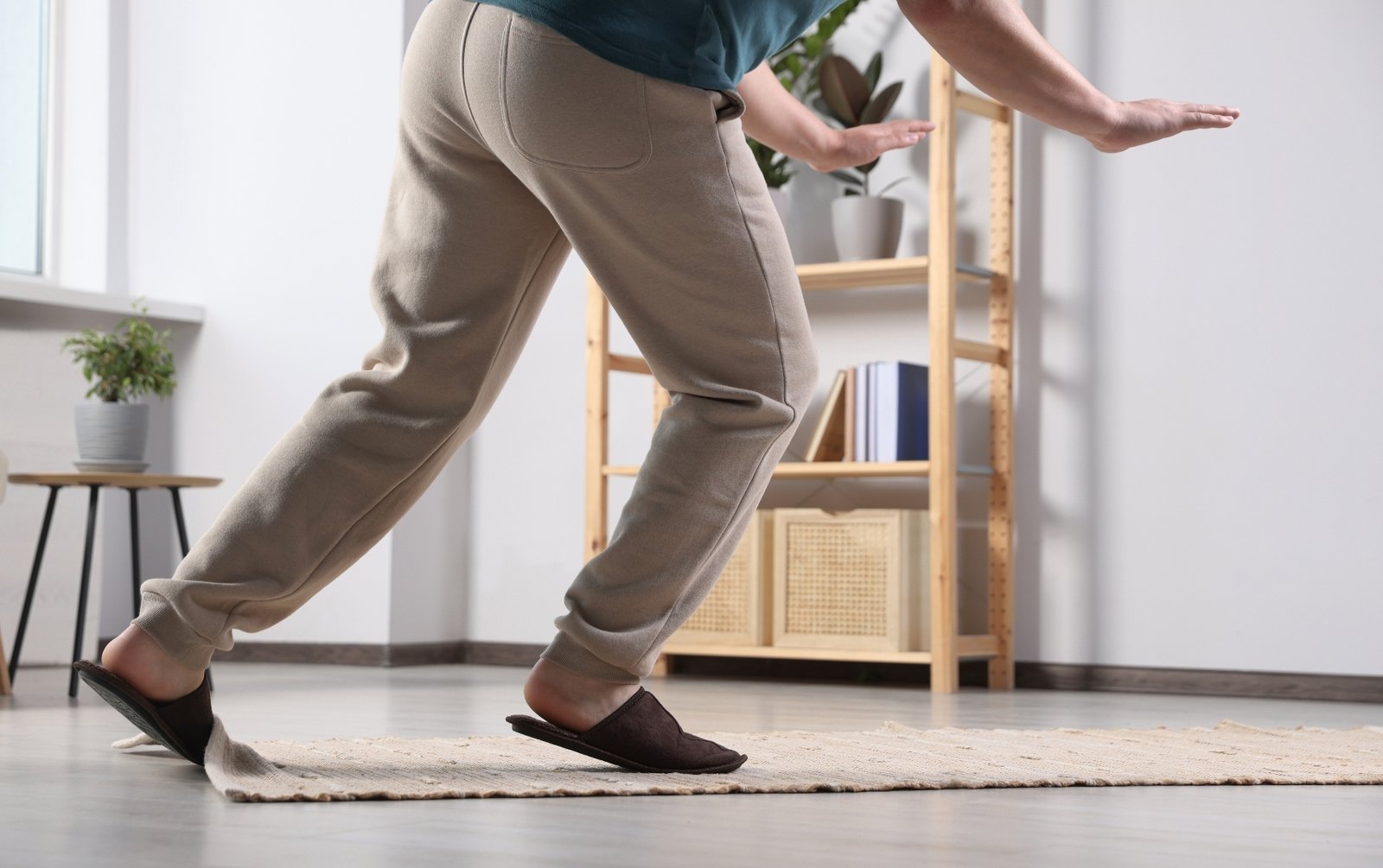 Person tripping on a rug