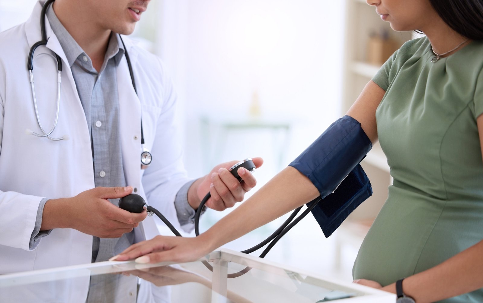 Woman visiting doctor, help in managing high blood pressure in pregnancy