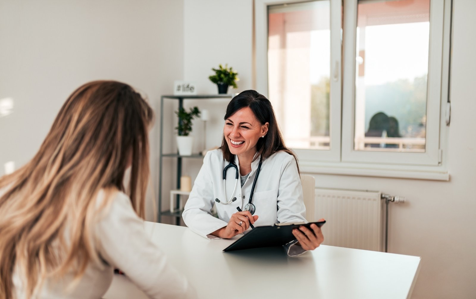 Woman talking to her primary care provider