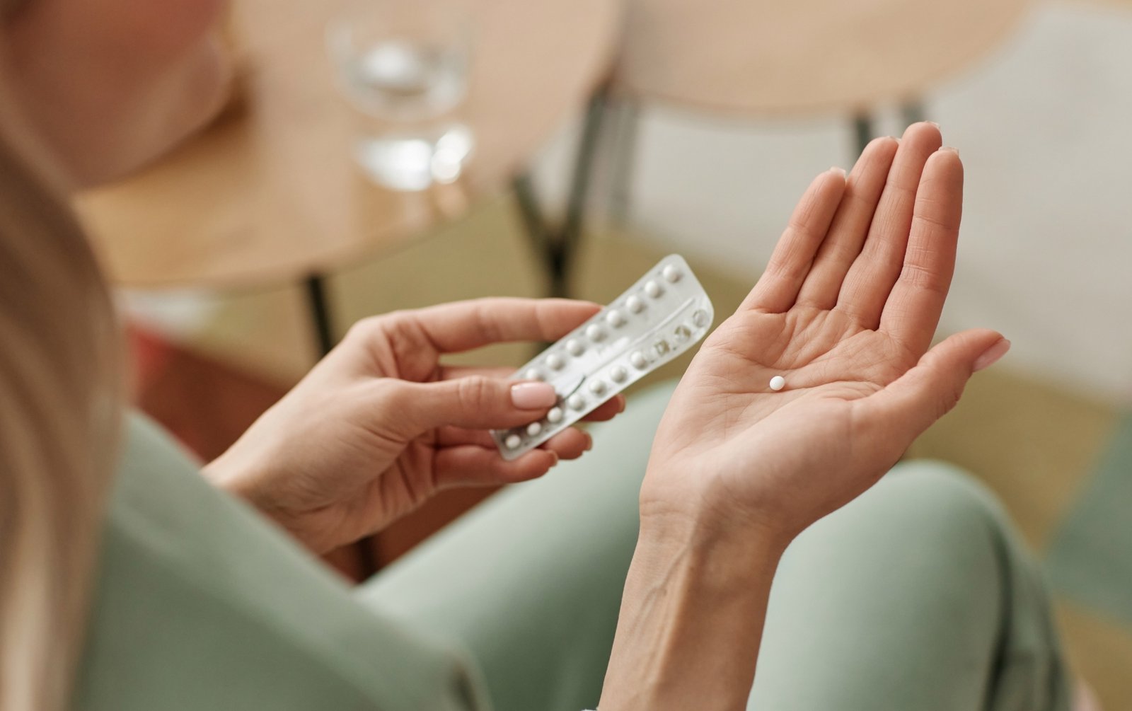 Woman taking birth control pills