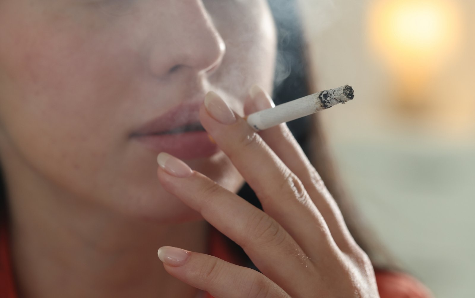 Woman smoking cigarette increases birth control stroke risk