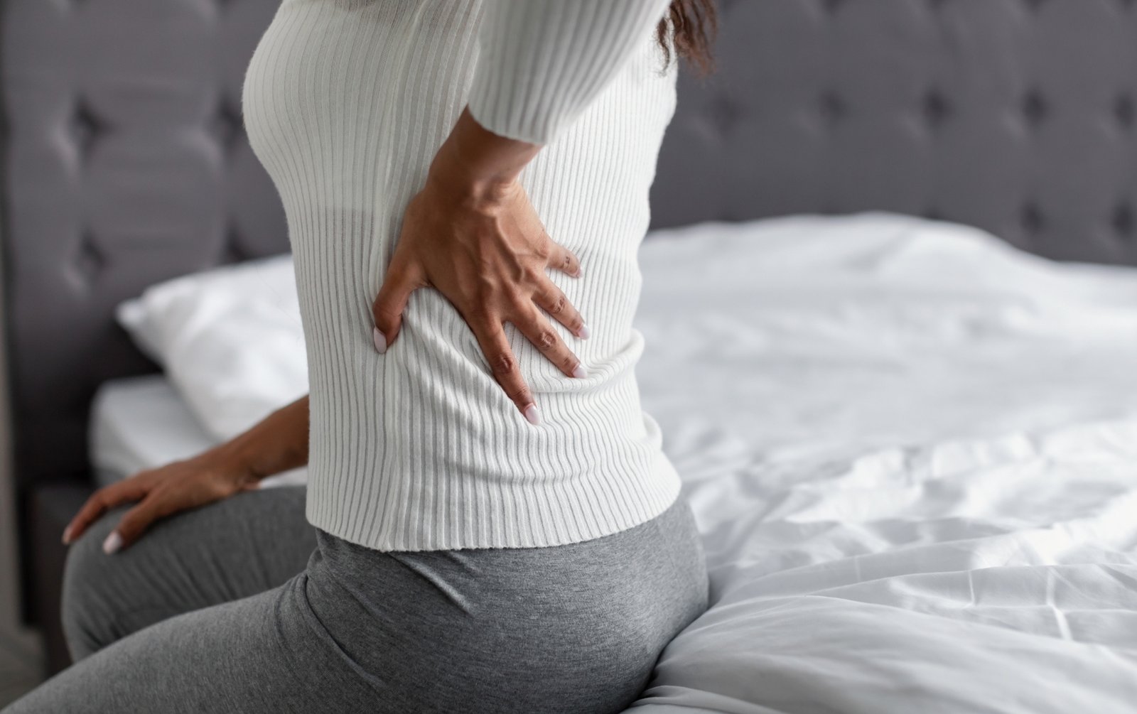 Young woman experiencing back pain